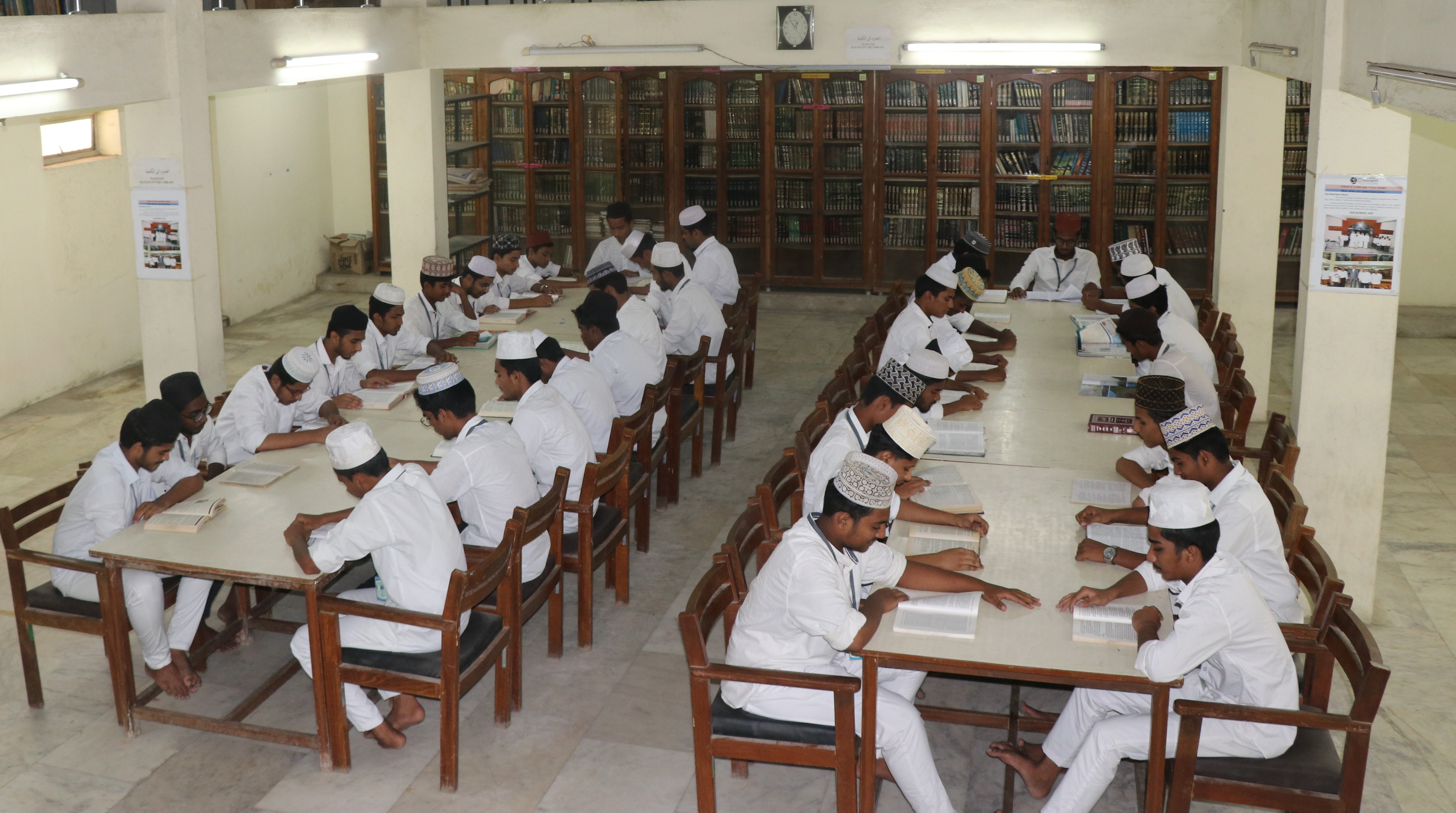 Students studying together in the college library